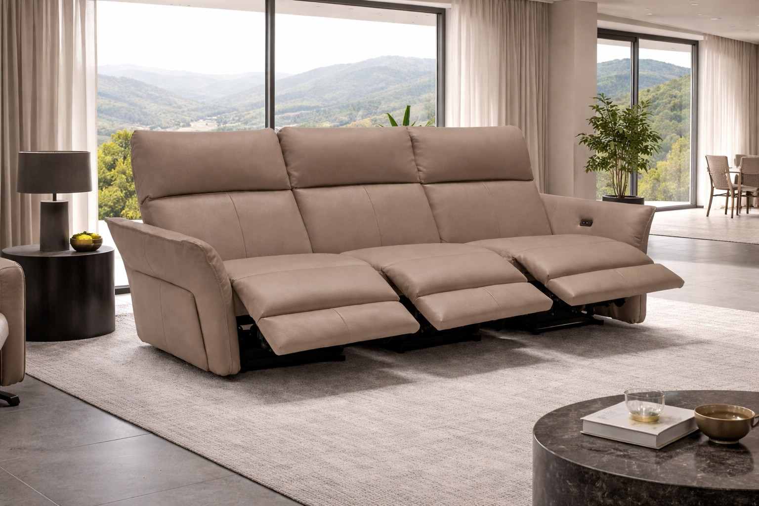 Canto modular Italian leather sofa with light brown triple electric recliners and power headrests, handcrafted in Italy, shown in modern living room with mountain view
